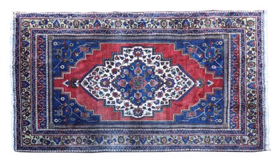 Lot 126 - An Anatolian blue ground carpet
