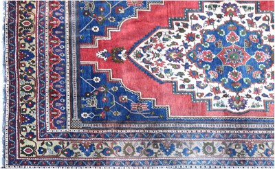 Lot 126 - An Anatolian blue ground carpet