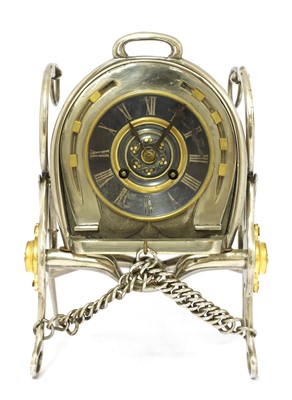 Lot 14 - An unusual French silver-plated table clock