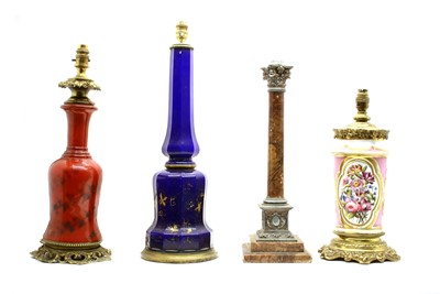 Lot 98 - Four 19th century coloured glass and other oil lamps