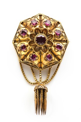 Lot 34 - A Victorian gold garnet set Etruscan style shield form brooch