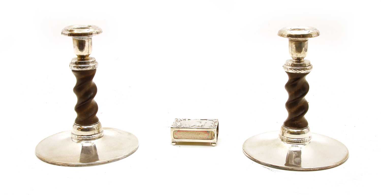 Lot 21 - A pair of turned wooden on white metal mounted candlesticks