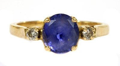 Lot 117 - A gold sapphire and diamond three stone ring