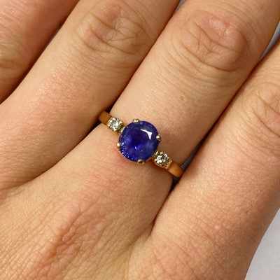 Lot 117 - A gold sapphire and diamond three stone ring