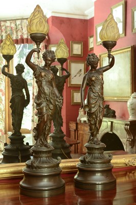 Lot 174 - A pair of bronzed spelter figural table lamps