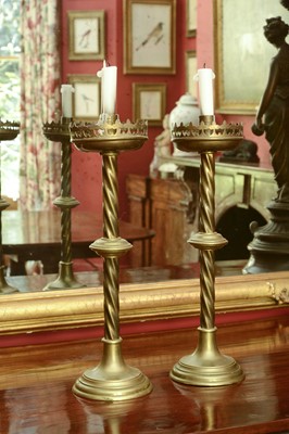 Lot 175 - A pair of ecclesiastical brass candlesticks