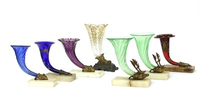 Lot 115 - A pair of green glass cornucopia vases