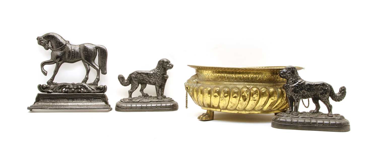 Lot 156 - A pair of cast iron St Bernard dog fireplace ornaments, a cast iron door stop as a Horse