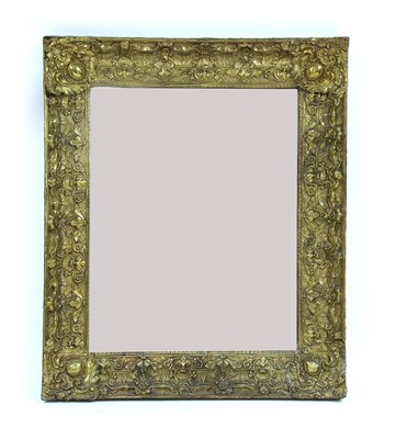 Lot 451 - A Dutch brass decorated frame wall mirror