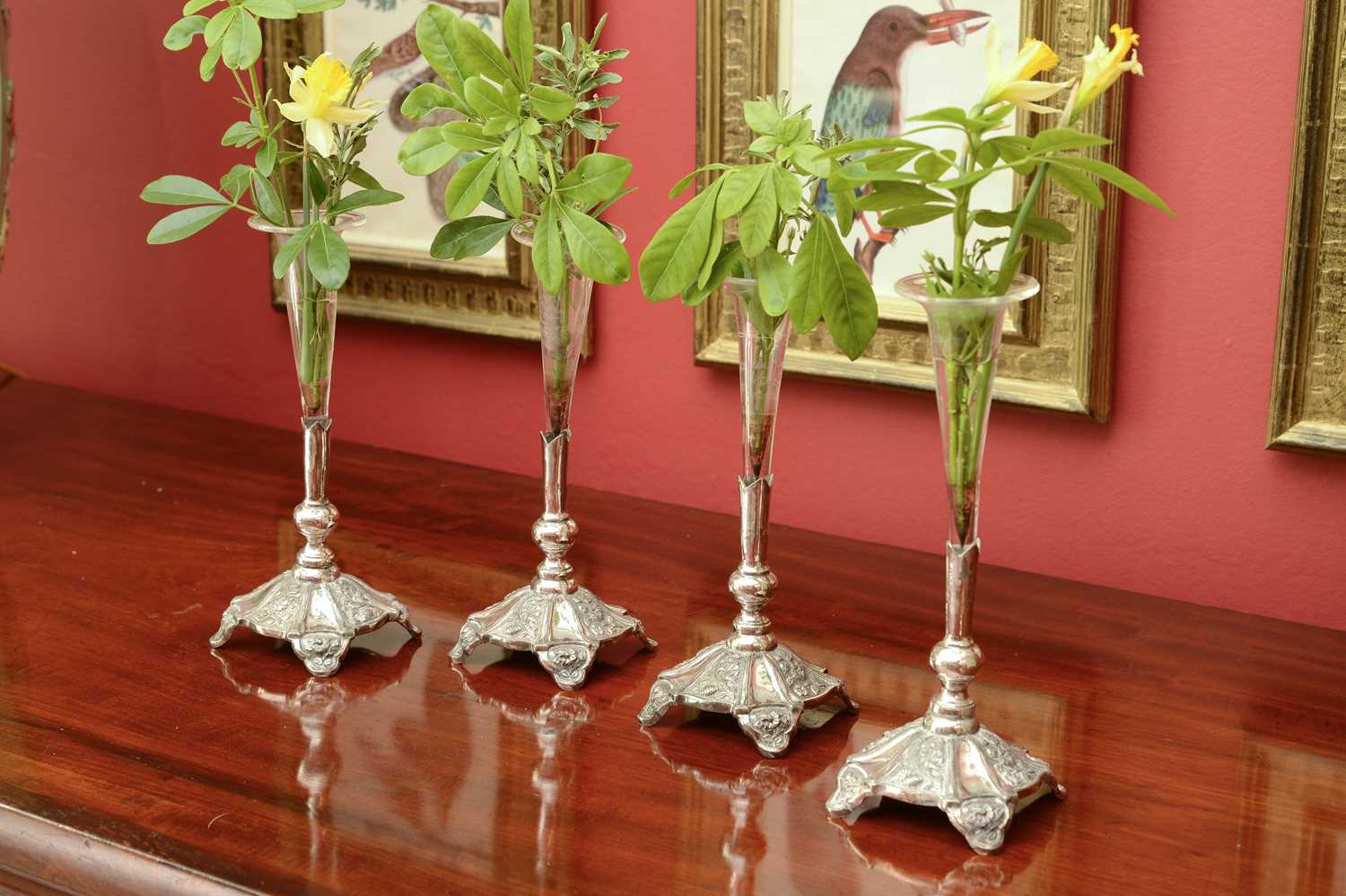 Lot 144 - A set of four silver plate and glass posy vases