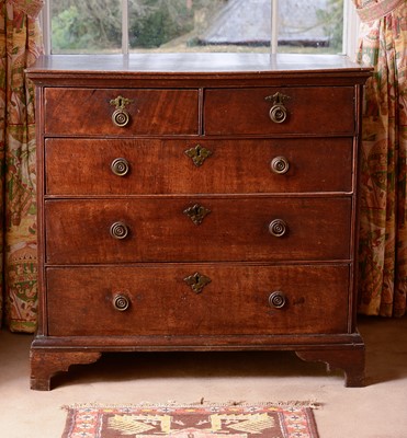 Lot 375 - An oak chest of two short over three long drawers
