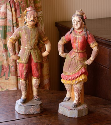 Lot 374 - A pair of glazed terracotta figures