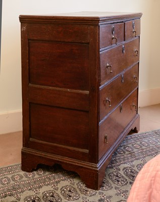 Lot 421 - An oak chest of two short over three long drawers