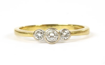 Lot 167 - An 18ct gold three stone diamond ring