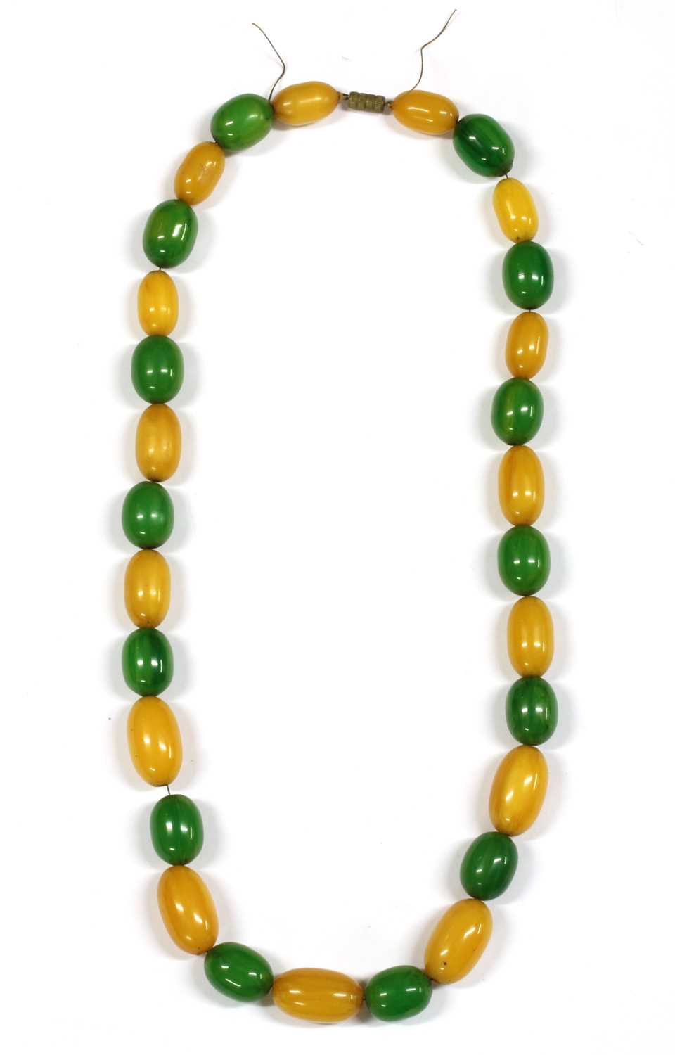 Lot 70 - A single row slightly graduated oval yellow and green Bakelite bead necklace