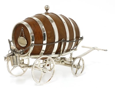 Lot 34 - A good simulated oak and silver-plated spirit waggon