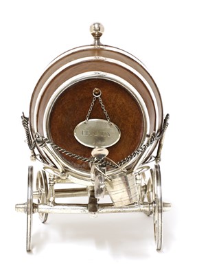 Lot 34 - A good simulated oak and silver-plated spirit waggon