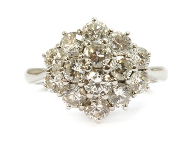 Lot 90 - An 18ct white gold diamond oval cluster ring