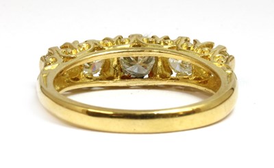 Lot 11 - An 18ct gold carved head-style five stone diamond ring