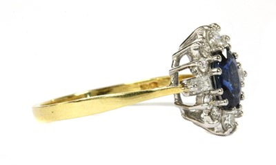 Lot 115 - An 18ct gold sapphire and diamond cluster ring