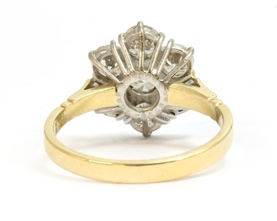 Lot 88 - An 18ct gold diamond daisy cluster ring