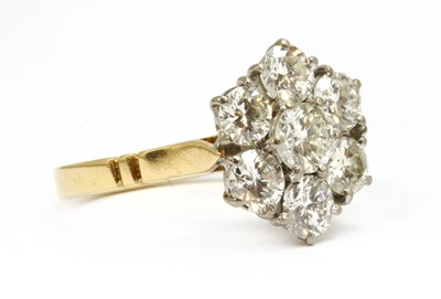 Lot 88 - An 18ct gold diamond daisy cluster ring