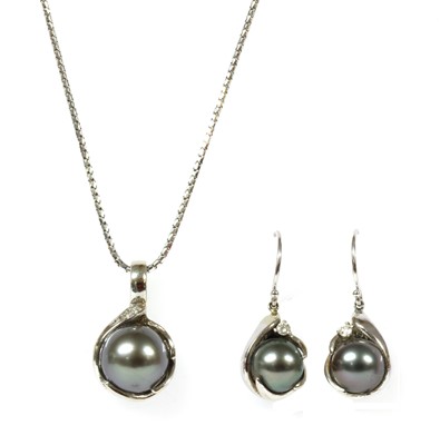 Lot 326 - A white gold cultured pearl and diamond pendant and earring suite