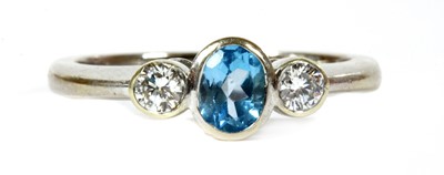 Lot 284 - A 9ct white gold blue topaz and diamond three stone ring