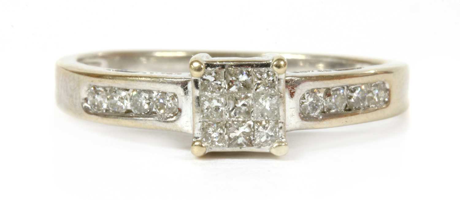 Lot 234 - An 18ct white gold diamond cluster ring