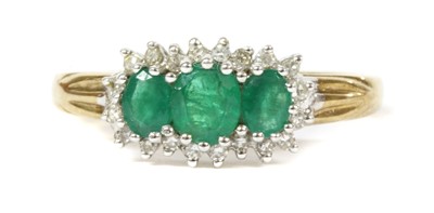 Lot 219 - A 9ct gold emerald and diamond triple cluster ring