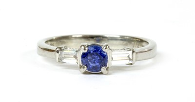 Lot 199 - An 18ct white gold sapphire and diamond three stone ring