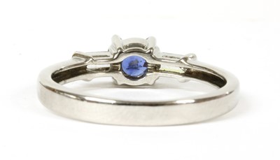 Lot 199 - An 18ct white gold sapphire and diamond three stone ring