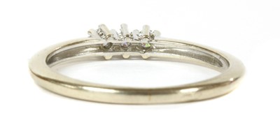 Lot 225 - A white gold three stone diamond ring