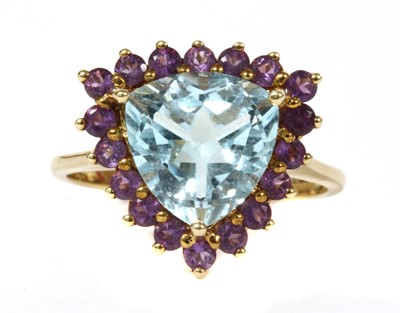 Lot 285 - A 9ct gold blue topaz and amethyst halo cluster ring
