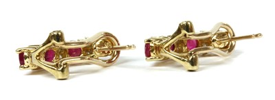 Lot 243 - A pair of 9ct gold ruby and diamond half hoop earrings