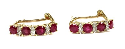 Lot 243 - A pair of 9ct gold ruby and diamond half hoop earrings