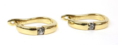 Lot 210 - A pair of gold diamond half hoop earrings