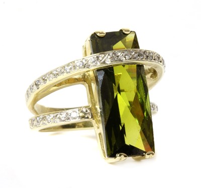 Lot 302 - A gold green tourmaline and cubic zirconia ring