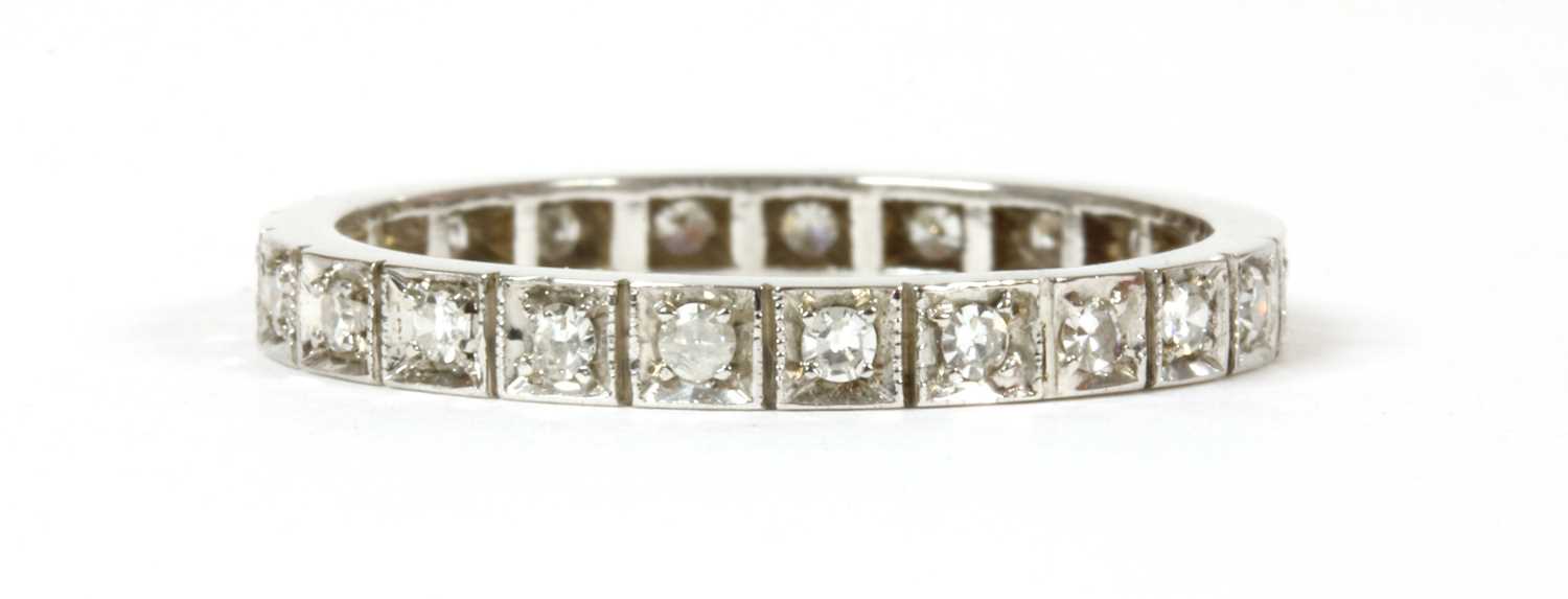 Lot 59 - A white gold diamond full eternity ring