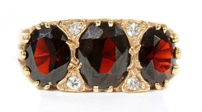 Lot 278 - A 9ct gold garnet and diamond ring