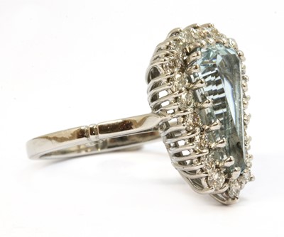 Lot 131 - A white gold aquamarine and diamond cluster ring