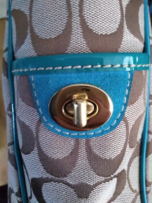 Lot 76 - A Coach teal suede and monogrammed canvas tote bag