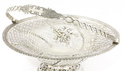 Lot 49 - A George III silver cake basket