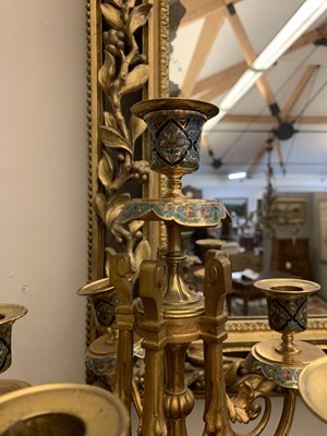 Lot 425 - A pair of gilt-bronze and champlevé enamel six-branch candelabra