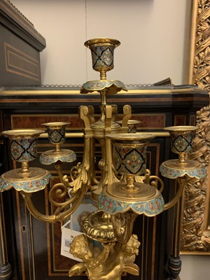Lot 425 - A pair of gilt-bronze and champlevé enamel six-branch candelabra