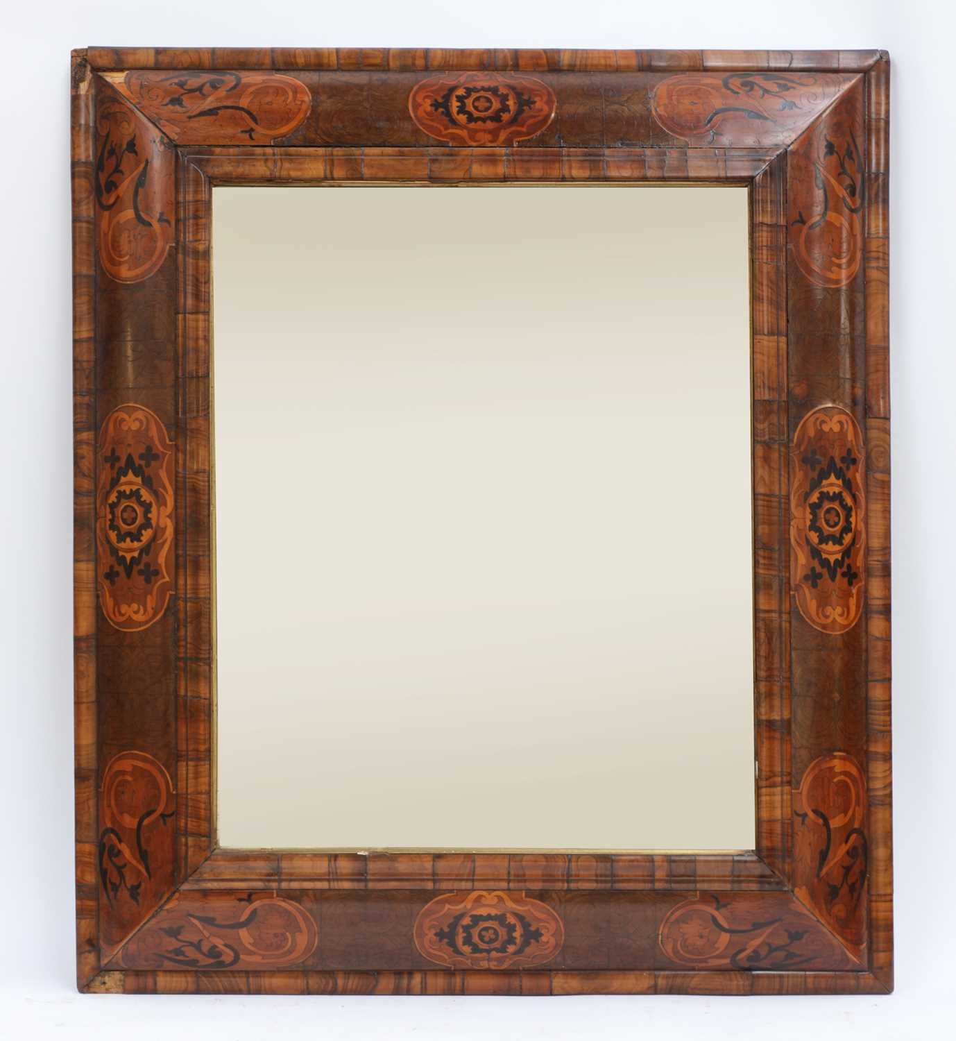 Lot 349 - A William & Mary walnut and marquetry cushion-framed mirror