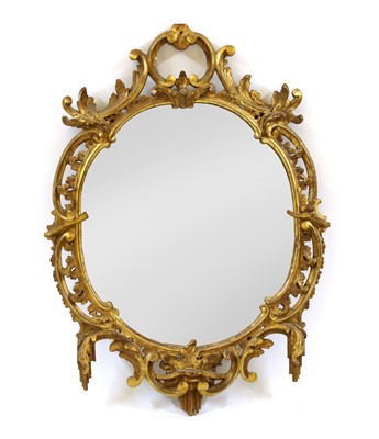 Lot 778 - A carved gilt pierced oval wall mirror