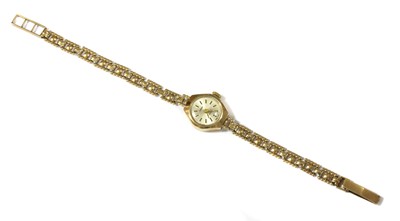 Lot 439 - A ladies' 9ct gold Caronnade mechanical bracelet watch