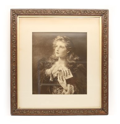 Lot 140A - An antique Victorian sepia portrait print of a young girl clasping a book