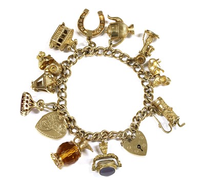 Lot 392 - A 9ct gold charm bracelet